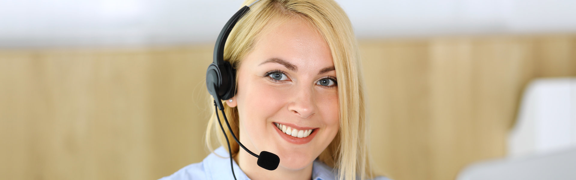 woman with headset smiling