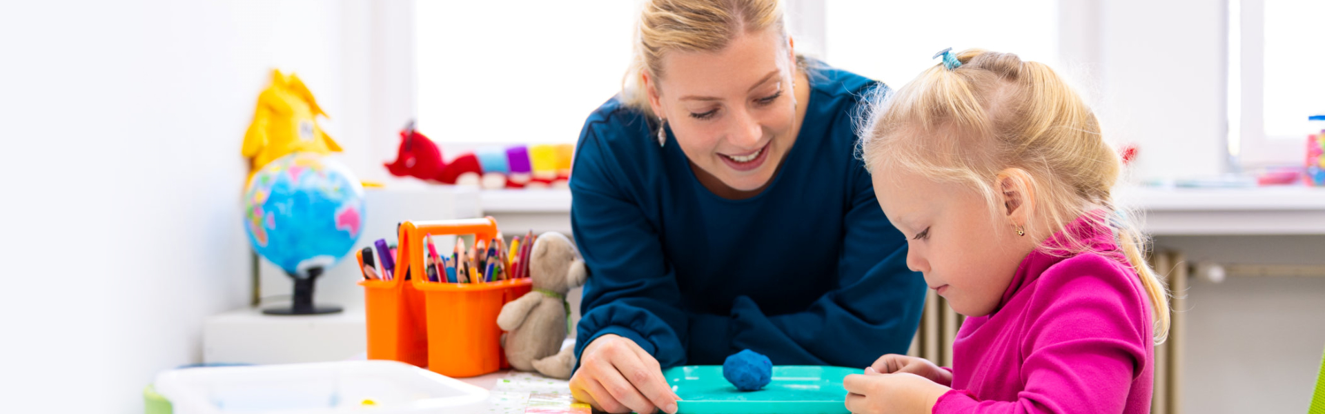 woman teaching child